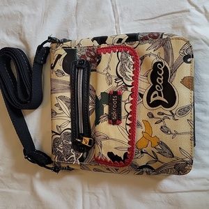 Sakroots leather purse. 9" by 8.5" with 22" adjustable strap.